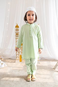 Adorable, made-to-order kurta for infant, toddler and kid boys! Available for Father and Son! Kurta ➤ Breathable and easy-to-wash cotton fabric ➤ Loop buttons that open easy (there are clasps on the back!) ➤ No-itch collar and sleeves ➤ Wide neck to easily fit over baby's head Pajama / Pant / Trouser ➤ Breathable and easy-to-wash cotton fabric ➤ White to match with several kotis, kurtas and occasions ➤ Stretchable elastic waistband Choti Koti kurtas are made without a nehru collar for our smalle Festive Green Pant Set For Wedding, Green Anarkali Pant Set For Wedding, Festive Cotton Sets With Naqshi Detail, Traditional Dabka Pant Set For Eid, Festive Cotton Naqshi Sets, Cotton Naqshi Sets For Festive Occasions, Cotton Churidar With Naqshi For Wedding, Cotton Anarkali Pant Set For Wedding, Anarkali Cotton Pant Set For Wedding