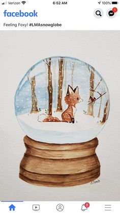 an image of a snow globe with a fox in the woods inside it on facebook