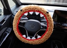 the steering wheel cover is decorated with fake teeth