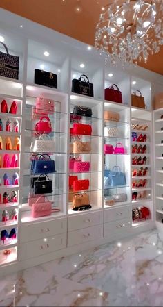 a room filled with lots of different types of purses