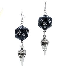 For Raven Queen worshippers who don't want to wear our huge and heavy (but very cool) raven earrings, we also offer this smaller, lighter (but still very cool) version. Each has a pearl black D20. Beneath the dice hang silvery raven skull charms. These would be a perfect accessory for someone playing a member of the shadar-kai or a cleric that worships the Raven Queen. A great gift for players of D&D, Pathfinder, and other tabletop RPGs -- or for anyone who wants to geek out with a fun and myste Black Fantasy Dangle Jewelry, Black Fantasy Style Earrings, Black Fantasy Earrings, Black Fantasy Style Pierced Earrings, Handmade Black Fantasy Earrings, Nickel Free Black Skull Earrings, Black Skull Earrings For Gift, Adjustable Black Skull Earrings, Adjustable Black Skull-shaped Earrings