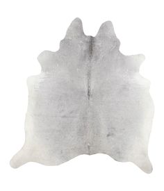 a white and gray cowhide rug on a white background with no one in it