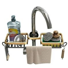 a bathroom sink with soap, sponges and other items