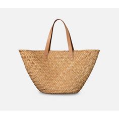 Market finds fit perfectly in this woven seagrass bag, with fully wrapped edges and durable leather straps. MeasurementsSmall: 22.5"L x 5.5"W x 12"HLarge: 23.5"L x 7"W x 14"HColor: Natural Seagrass Natural Bucket Bag With Intrecciato Weave, Everyday Straw Bags With Intrecciato Weave, Chic Rattan Bags With Woven Leather, Beige Basket Bag With Intrecciato Weave, Straw Bucket Shoulder Bag With Intrecciato Weave, Summer Straw Shoulder Bag With Intrecciato Weave, Vacation Straw Bag With Intrecciato Weave, Rectangular Natural Bags With Intrecciato Weave, Natural Rectangular Bag With Intrecciato Weave