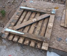 a wooden door is laying on the ground next to some construction tools and other items