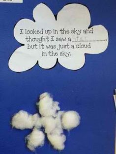 a bulletin board with clouds and a poem