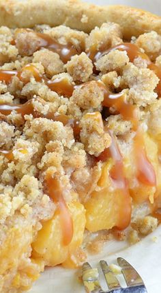 a close up of a slice of pie on a plate with an orange in the background