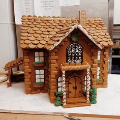 a gingerbread house made to look like it is being built