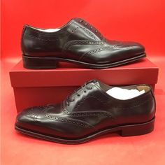 New Elongated And Elegant Proportions Define The Poveda Oxford Shoe From Ferragamo. Crafted From Soft Calf Leather, These Lace-Up Pair Are Finished With Intricate Broguing On The Toe And Upper, Displaying Expert Craftsmanship And An Element Of British Charm. Composition Outer: Calf Leather 100% Lining: Calf Leather 100% Sole: Calf Leather 100% Includes Box And Dust Bags Size 9.5 Ee (Wide) Fitted Luxury Leather Shoes For Semi-formal Occasions, Luxury Black Oxfords For Semi-formal Occasions, Designer Fitted Leather Shoes For Semi-formal Occasions, Designer Semi-formal Leather Shoes, Luxury Dress Shoes For Galas, Elegant Goodyear Welted Leather Shoes For Galas, Elegant Leather Shoes With Brogue Detailing For Galas, Italian Luxury Black Oxfords, Elegant Fitted Oxfords For Galas