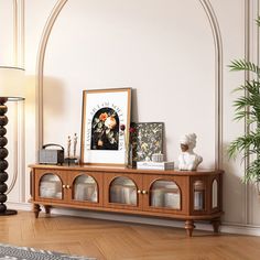 a living room with white walls and wooden furniture