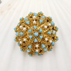 Pretty and unusual domed vintage brooch has a unique base with faux applied beads and open metal work in a very pretty gold tone metal.  Turquoise blue glass stones in round and triangle join small white faux pearls in creating a lovely raised pattern on the domed base.  Brooch is about 1.25 inches in diameter and dome is about 3/4 inch high.  Unsigned and in very good vintage condition. Blue Cabochon Brooches For Wedding, Vintage Heart Jewelry, Big Heart Necklace, Czech Jewelry, Unique Brooch, Monet Jewelry, Brooch Vintage, Cat Jewelry, Pearl Brooch