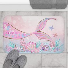 a bathroom rug with a mermaid tail on it