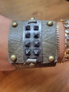 Edgy Leather Bracelets With Rivets, Punk Cuff Bracelets With Rivets, Punk Leather Wrist Strap Jewelry, Punk Leather Jewelry With Wrist Strap, Punk Style Leather Jewelry With Wrist Strap, Edgy Leather Bracelet For Party, Edgy Adjustable Cuff Leather Bracelet, Edgy Leather Jewelry With Studs, Leather Cuff Bracelets For Party