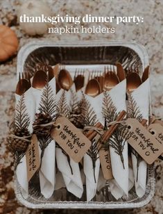 thanksgiving dinner party napkin holders with forks and spoons wrapped in brown paper, tied with twine