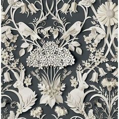 an intricately designed wallpaper with birds and flowers in gold, black and white