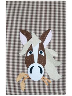 a brown and white horse with a bone in it's mouth on a checkered background