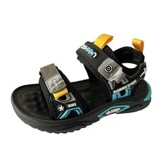 a black sandal with blue and yellow straps on the bottom, one foot in the air