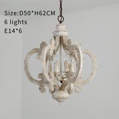 a white chandelier hanging from a ceiling