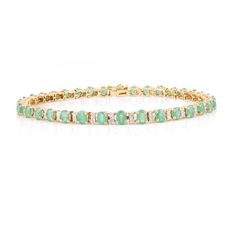 This is part of Chairish’s Fine Jewelry assortment.  This Oval Cut Emerald and Diamond Tennis Bracelet in 18K gold showcases endlessly sparkling natural emerald, weighing 5.68 carat and diamonds weighing 0.74 carats. It measures 7.5 inches long in length.  Emerald enhances intellectual capacity of the person. Designed with perfect oval cut emerald with diamonds set after each emerald to make you stand out on any occasion or event. The elegant style complements the attire beautifully and is a per Luxury Green Gold Bracelet For Anniversary, Green Brilliant Cut Diamond Bracelet In Fine Jewelry Style, Fine Jewelry Emerald Bracelet With Brilliant Cut, Green Brilliant Cut Diamond Bracelet, Green Brilliant Cut Diamond Bracelet Fine Jewelry, Luxury Green Oval Tennis Bracelet, Fine Emerald Tennis Bracelet In Yellow Gold, Fine Jewelry Emerald Tennis Bracelet In Yellow Gold, Elegant Gold Emerald Tennis Bracelet