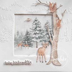 a card with deers and trees in the snow, on a white paper background