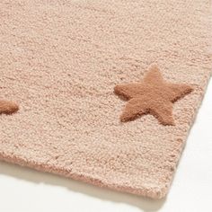 two star shaped rugs are on the floor