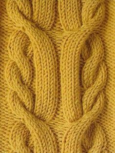 an image of a knitted sweater with leaves on the front and back side, as seen from above