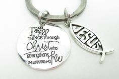 a silver keychain with a quote on it that says i can't go things through christ who straightens me