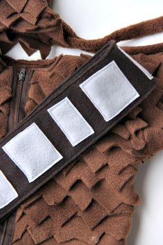 a close up of a piece of clothing with patches on it's back side