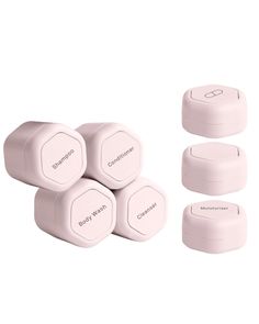 four pink pill cases sitting next to each other