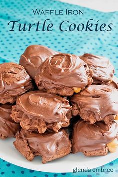 chocolate turtle cookies on a white plate with the title in the middle reads, waffle iron turtle cookies