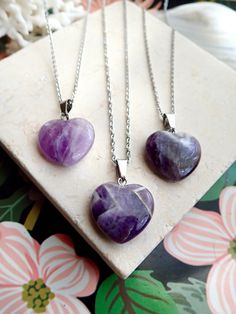 This polished genuine amethyst heart pendant hangs from your choice of chain.The February birthstone, amethyst, is said to strengthen relationships and give its wearer courage. At one time, only royalty could wear the gem. Ancient Greeks thought that the amethyst guarded against intoxication. In fact, “amethyst” comes from amethystos, a Greek word meaning “sober.”Amethysts are the birthstone for February and also traditionally given on the 6th wedding anniversary.- 18" Rhodium Plated Chain. ‚Ä¢ 6th Wedding Anniversary, Amethyst Heart, Healing Stones Necklace, Word Meaning, Birthday List, Greek Words, February Birthstone, February Birth Stone, Healing Stones