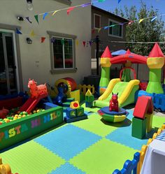 an inflatable bounce house with slides and toys