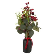 a black vase filled with red berries and greenery on top of a white background