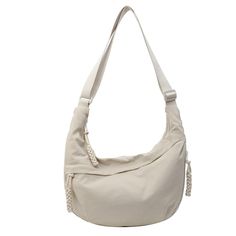 a white purse on a white background with the strap down to it's shoulder