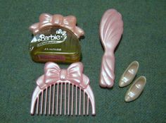 the hair comb is next to two pairs of slippers and a container of soap