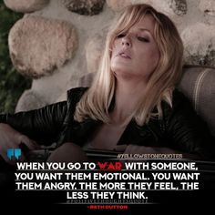 a woman sitting on top of a chair next to a stone wall with a quote