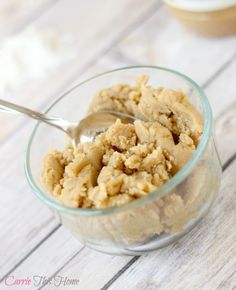 a glass bowl filled with oatmeal on top of a wooden table