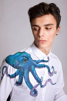 Octopus handpainted shirt Size M , Ready to ship This shirt is one of a kind and won't be repeated. But you can contact me if you wish octopus design on the t-shirt, sweatshirt or on the buttons down shirt Shirt is 100 % poplin cotton , slim fit Model is wearing size Medium For paint on shirt I use eco friendly water based fabric paints. You can wash such shirt in washing machine ( 30 degree delicate cycle) Delivery: express shipping 3-4 days Measurements M chest 100 cm (39.5 inches) ,waist 90 c Paint On Shirt, Ocean Fashion Design, Painted Octopus, Mens White Shirt, Galaxy Shirt, What Should I Wear Today, Octopus Design, Paint Shirts, White Shirt Men