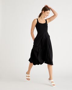 Fit and flare is endlessly flattering. Our sleeveless, scoop neck dress is no exception. Made from Tencel that's soft and light, it's designed to move with you, wherever the day takes you. This is a comfy approach to your LBD, and the side-seam pockets make it equally practical and versatile. Plus, when anyone compliments you, you get to say, "Thanks, it's got pockets!"Also offered in sizes 1X - 3X.  | Quince | Women's Fit & Flare Knit Dress in Black, Size XS, Tencel Chic Stretch Sleeveless Dress With Scoop Neck, Chic Sleeveless Scoop Neck Stretch Dress, Stretch Sleeveless Summer Dress With Flattering Silhouette, Scoop Neck Stretch Sleeveless Summer Dress, Casual Sleeveless Midi Dress With Flattering Silhouette, Casual Scoop Neck Midi Dress For Summer, Casual Summer Midi Dress With Scoop Neck, Fit And Flare Sleeveless Summer Dress, Summer Stretch Midi Dress With Scoop Neck