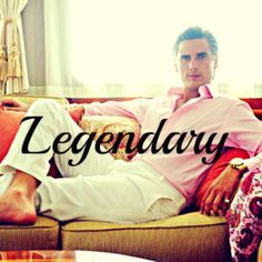 a man sitting on top of a couch in front of a window with the words legendday over it