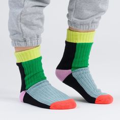 MoMA Exclusive: The convenient ease of socks meets the cushy comfort of house slippers. These unisex Verloop Knit House Socks truly combine the best of both worlds. In playful punchy colors, this pair is lined with fluffy fleece so you can feel super cozy and look extra bright. There's even non-slip patches on the soles to prevent slipping during any impromptu indoor dance parties. These Verloop Knit House Socks are made from 90% acrylic and 10% spandex with a polyester lining.� Verloop (Dutch f Casual Multicolor Knitted Socks, Casual Warm Multicolor Socks, Green Casual Socks For Playtime, Comfortable Green Winter Socks, Casual Green Socks For Playtime, Green Winter Socks, Playful Super Soft Multicolor Socks, Comfortable Non-slip Multicolor Socks, Comfortable Multicolor Non-slip Socks