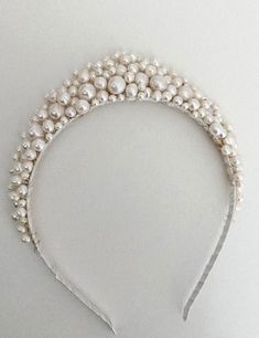 A handmade tiara of freshwater pearls. This design measures one inch at the highest point.  The ribbon around the band comes in a variety of colours (brown, white, black, blush, blonde).  . Each piece will be unique as I make them by hand for customers - there will be slight  variations. If you would like me to send you a photo of your tiara before I post it, so that you can check you're completely happy with it, then please send me a message. SHIPPING AND PACKAGING- All Ivy and Pearl hairpieces Handmade Tiaras, Hair Accessories Wedding, Pearl Tiara, Hair Jewellery, Hair Adornments, Accessories Wedding, Wedding Headband, Bridal Tiara, Bridal Hair Accessories