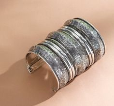 The classic piece of hand crafted Silver Spiral Cuff Bangle- Unique for Girls especially when they're as versatile, light & elegant as the beauties hand-picked for you. It will also go with casual wear, daily wear, everyday wear, & college wear. -Base Metal - Alloy, Brass -Plating - German Silver -Sizing - Free Size -Type - Bangles -Light Weight -FREE Shipping -Gift Wrapping Available -Delivery from a Small Business in India -Handmade Product Skin friendly- Nickel free & lead free as per international standards. Anti-allergic & safe for skin. Ideal for Gifting purposes for your sister or Gf Occasion- Best for Gifting, for Birthdays, Parties, Anniversary, Weddings & Festivals We tried to cover as many details as possible in our pictures, videos, & description. These bangles are very well ma Traditional Oxidized Bangle Cuff Bracelet, Ornate Oxidized Bangle Cuff Bracelet, Traditional Silver Carved Cuff Bracelet, Vintage Oxidized Bangle Cuff Bracelet, Nickel-free Bohemian Bangle Cuff Bracelet, College Wear, Hand Cuff Bracelet, Jewelry Safe, Brass Bracelet