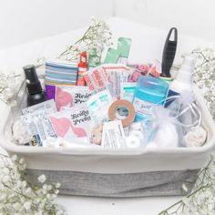 a white container filled with lots of different types of personal care items on top of a table