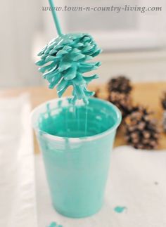 a pine cone is sticking out of a cup