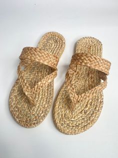 Sandals Straw Summer made of water hyacinth. we decorate pom pom and tassel on this sandals. they are unique and beautiful. ** If you buy this sandals = Safe the world :) **Made to Order  Measurement of Sandals  S = EU 35-36 (3.5*9inches) M = EU 37-38 (3.6*9.5 inches) L = EU 39-40 (3.7*10 inches) XL = EU 41-42 (4*10.6 inches) 2XL = EU 43-44 (4*11 inches) If you not sure size please feel free to contact me :) **we have time to made this sandals 3-5 days Measurement your feet by self  http://m.wik Handmade Bohemian Slip-on Flip Flops, Bride Shower Gifts, Brown Non-slip Beach Slippers, Beach Non-slip Synthetic Slippers, Beach Slippers Non-slip In Beige, Straw Sandals, Non-slip Synthetic Beach Slippers, Bride Shower, Beach Slippers