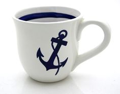 a coffee cup with an anchor painted on it