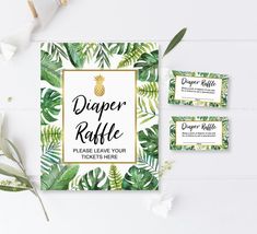 three business cards with tropical leaves and pineapples on them, next to some flowers