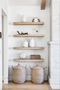 some shelves with baskets and vases on them