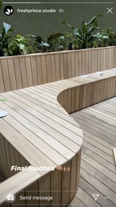 a wooden bench sitting on top of a wooden deck